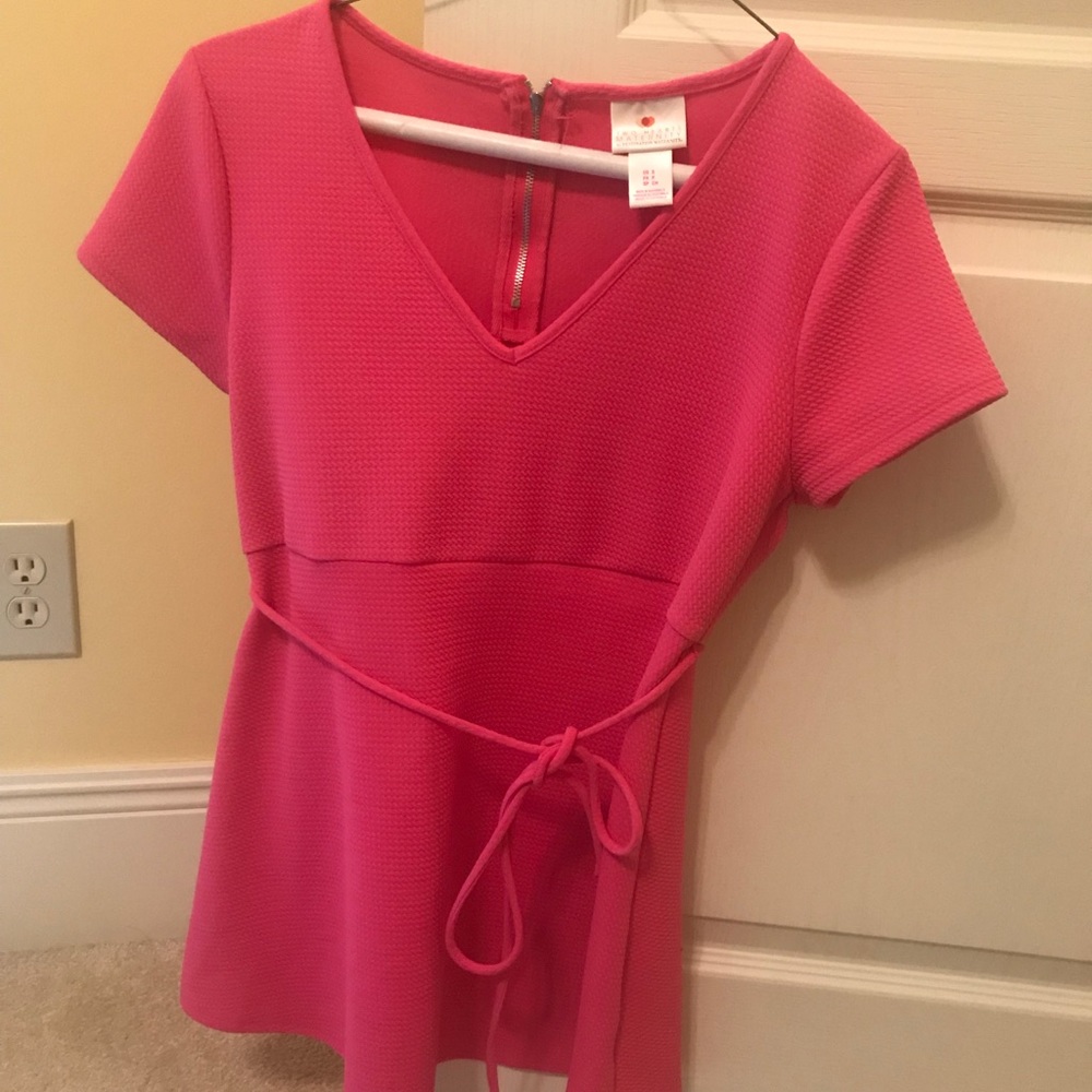 Pink maternity shirt.